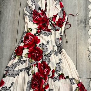 Ivory floral dress with crisscross tie back.